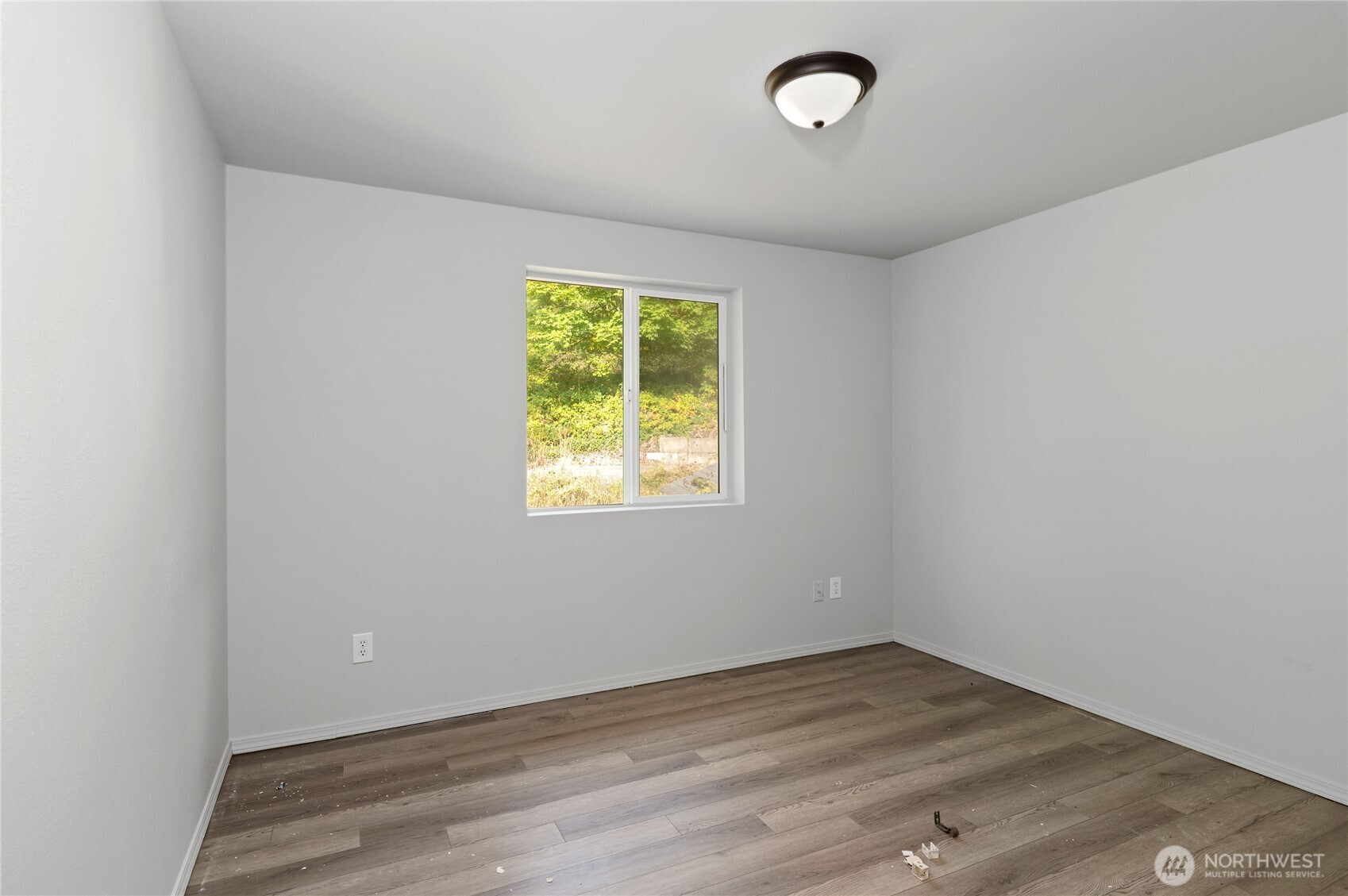 5151 East Pickering Road Shelton, WA 98584 - Photo 24 of 27 an empty room with wooden floor and windows