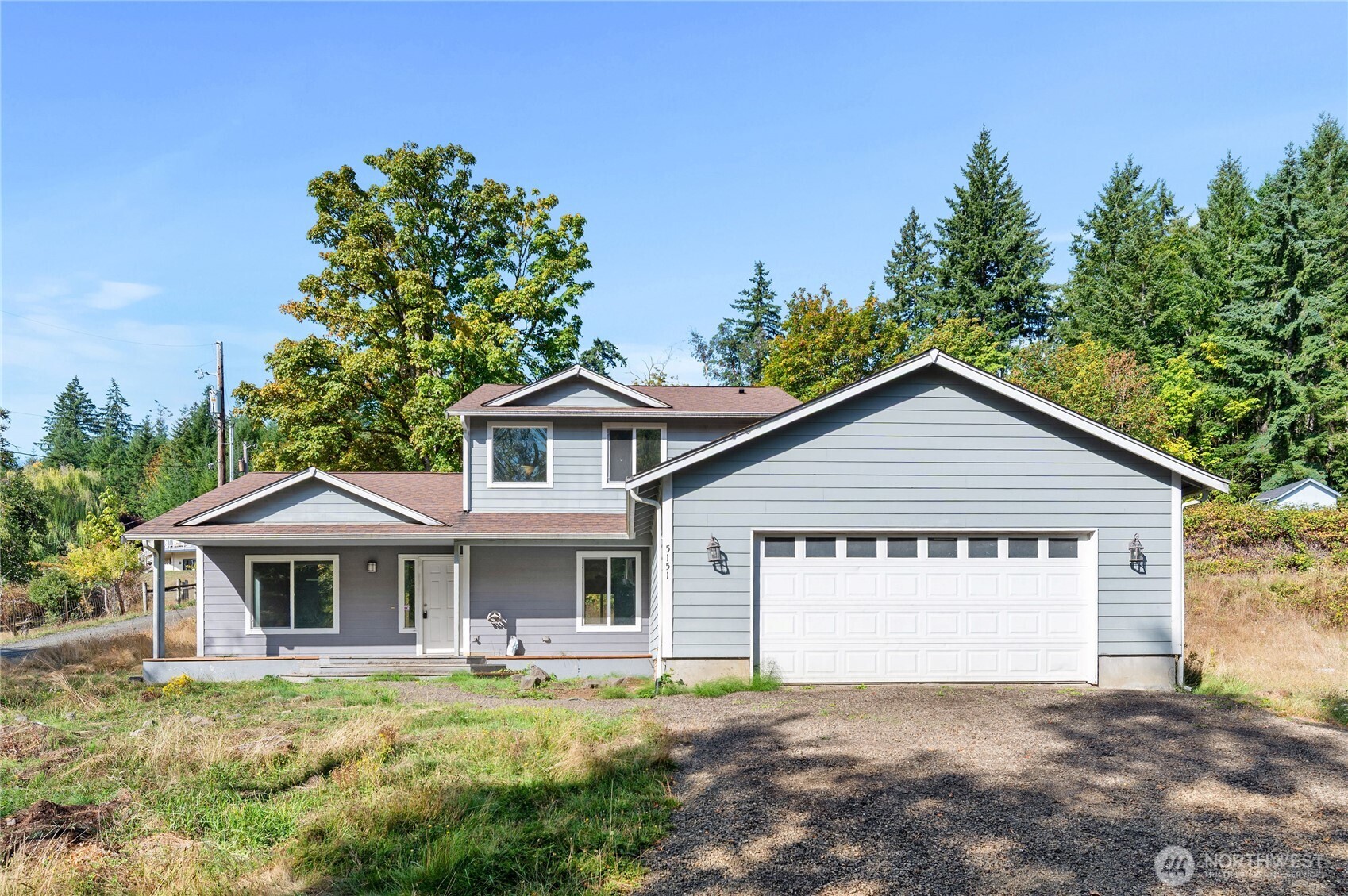 5151 East Pickering Road Shelton, WA 98584 - Photo 5 of 27 a front view of a house with a garden and yard