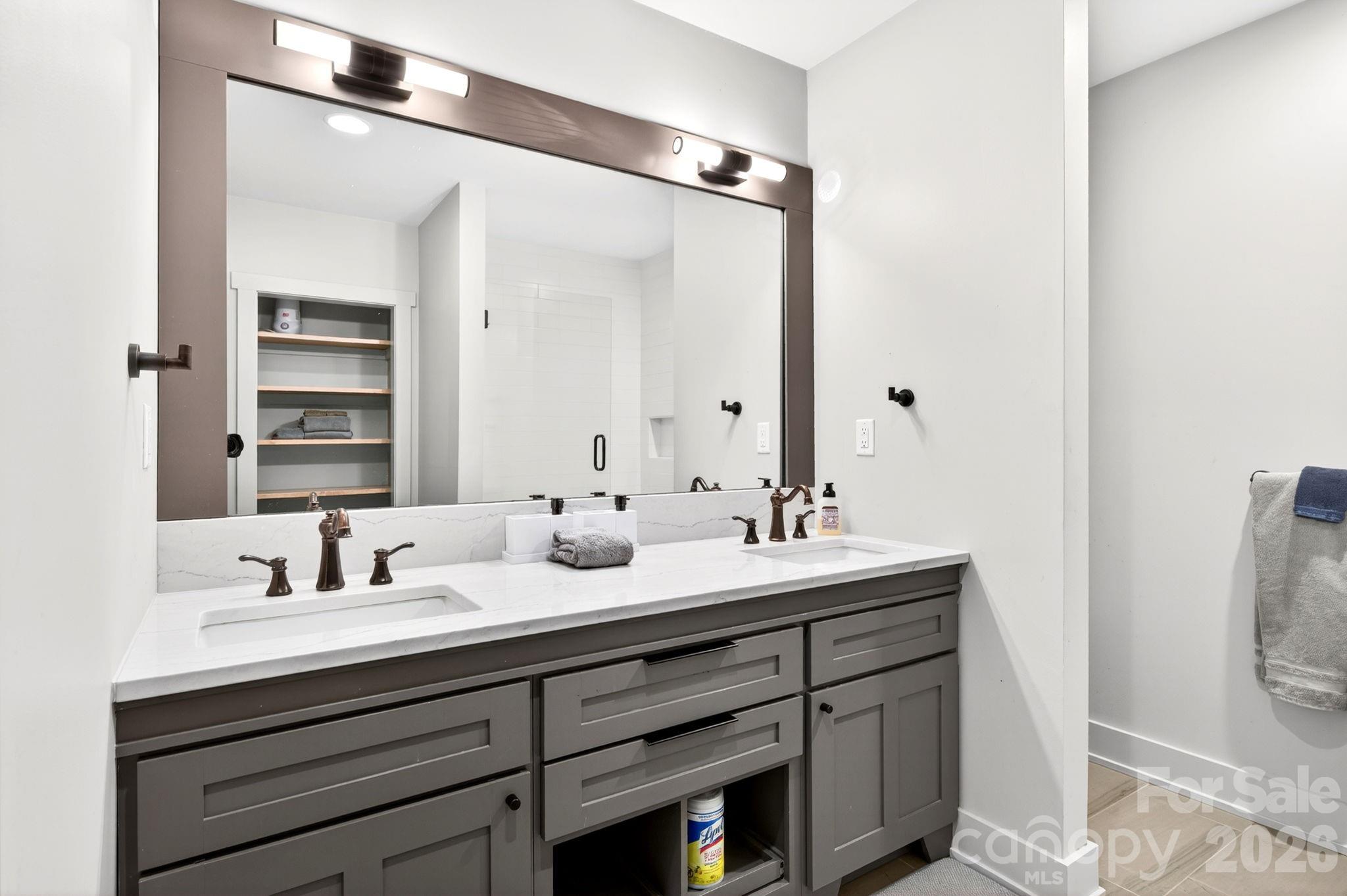 235 Bull Creek Road Asheville, NC 28805 - Photo 27 of 47 a bathroom with a sink double vanity and a mirror