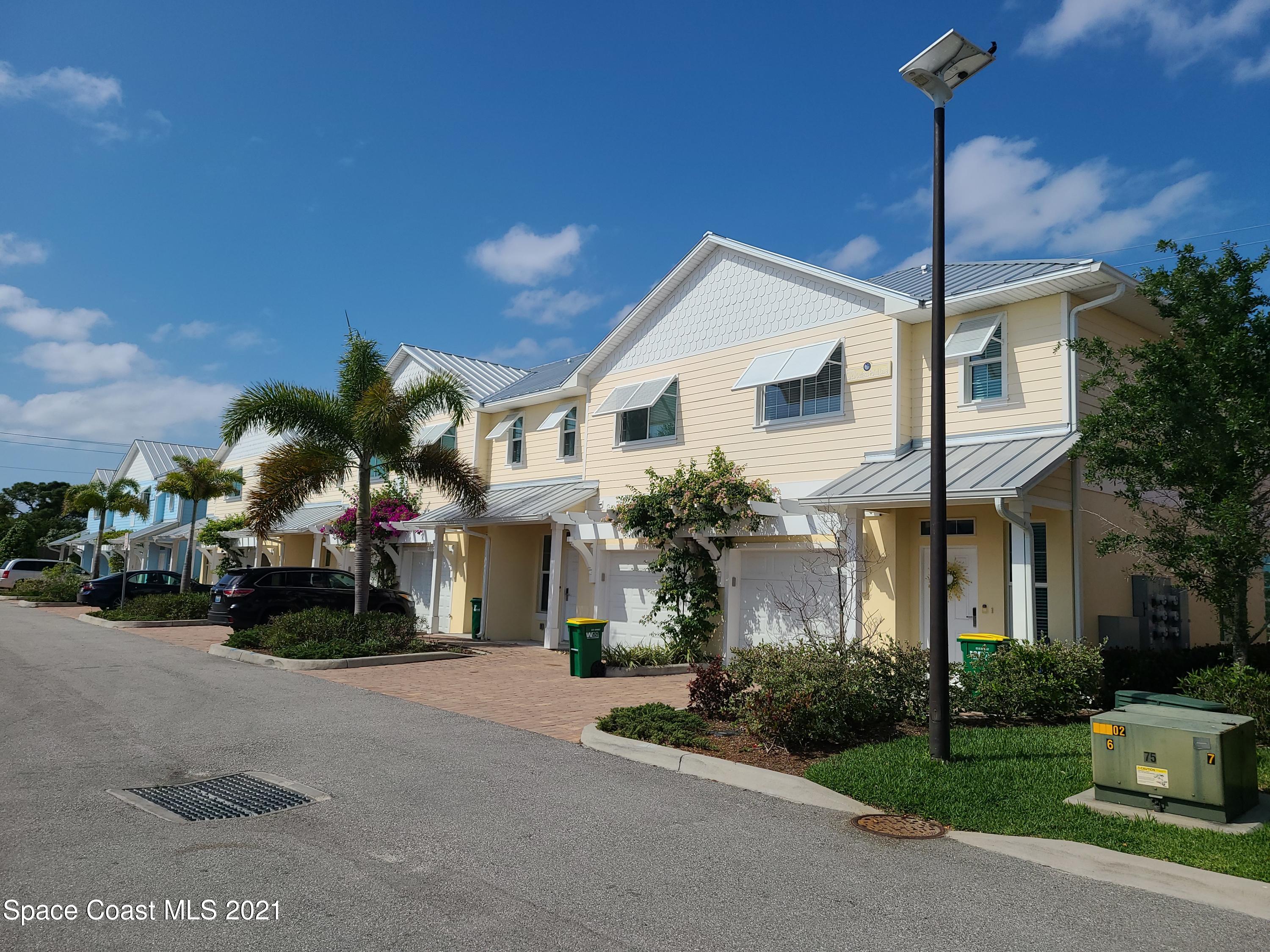 a view of a house with a street