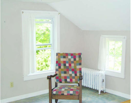 12 Green Road Sutton, MA 01590 - Photo 4 of 8 a bedroom with furniture and a window