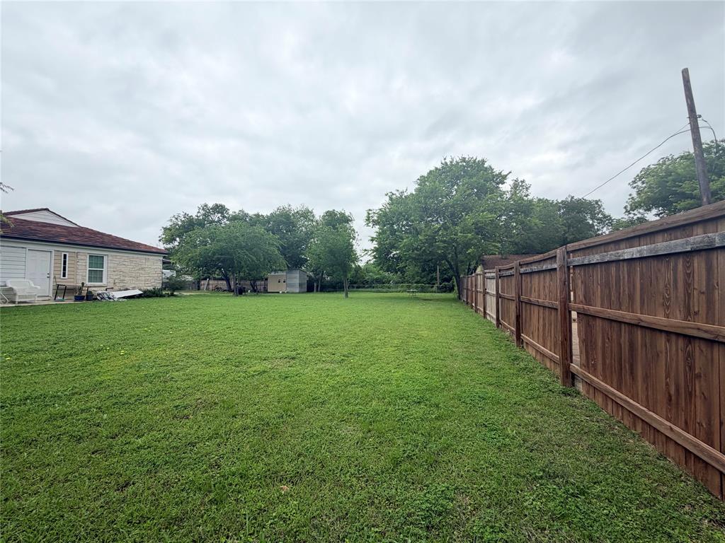 5633 Oak Grove Road Fort Worth, TX 76134 - Photo 4 of 7 a view of a backyard with green space
