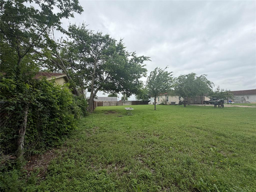 5633 Oak Grove Road Fort Worth, TX 76134 - Photo 7 of 7 a view of grassy field with benches
