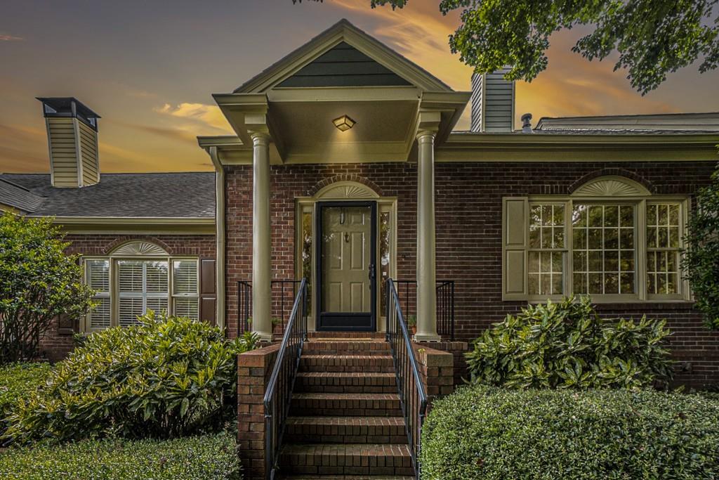 1430 Winston Place Decatur, GA 30033 - Photo 1 of 1 a front view of a house with plants