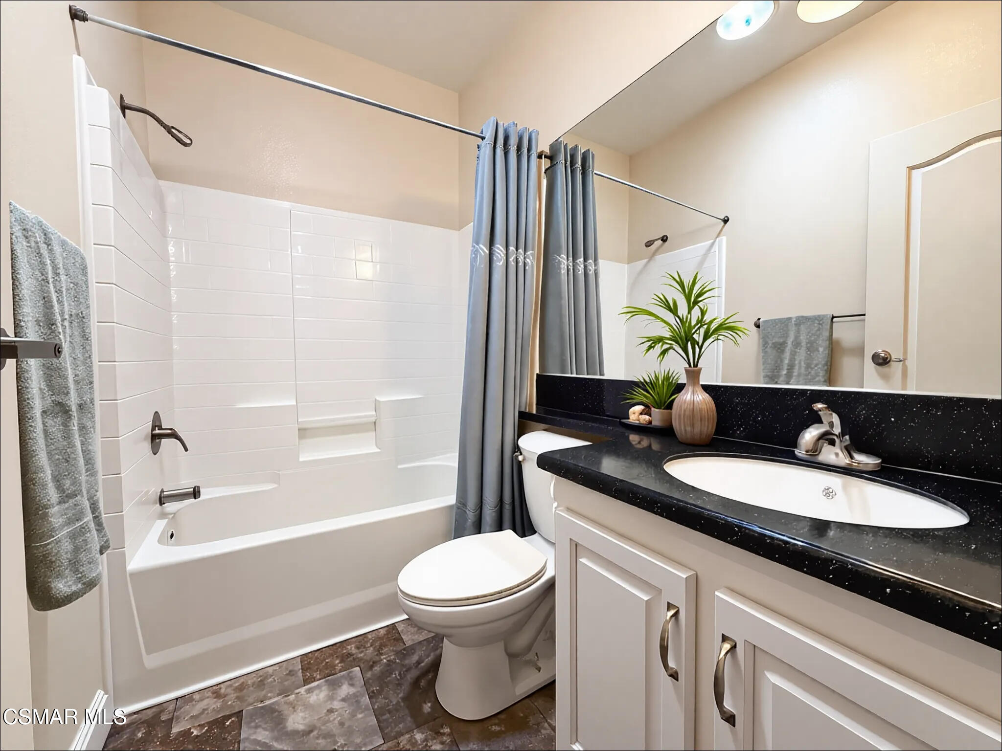 114 Stevens Circle Ventura, CA 93003 - Photo 11 of 29 a bathroom with a granite countertop sink toilet a mirror and shower