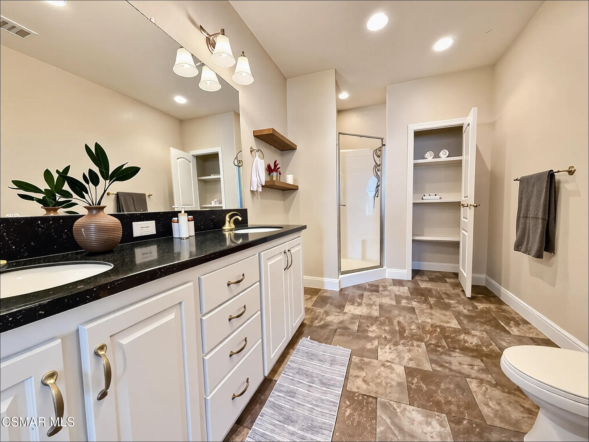 114 Stevens Circle Ventura, CA 93003 - Photo 5 of 29 a spacious bathroom with a double vanity sink and a mirror