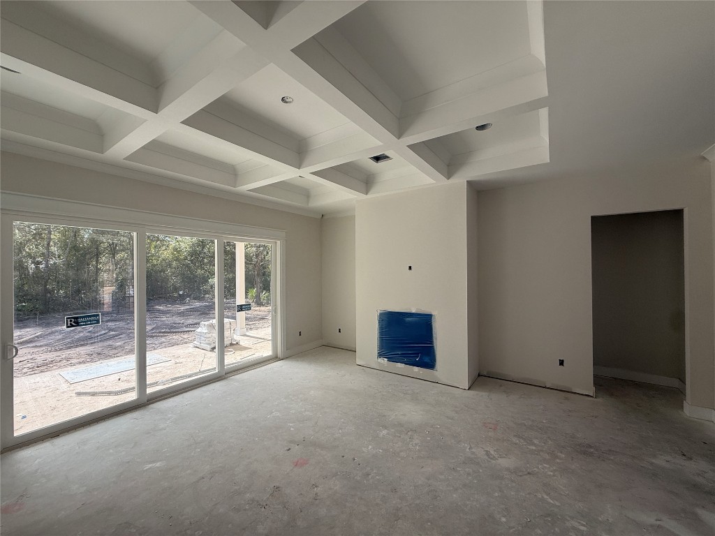 96076 Captains Pointe Road Yulee, FL 32097 - Photo 5 of 11 an empty room with sliding glass door and outer view