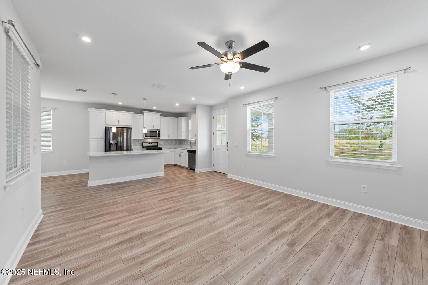 117 Redbud Lane Yulee, FL 32097 - Photo 11 of 20 a view of a kitchen with wooden floor and a window