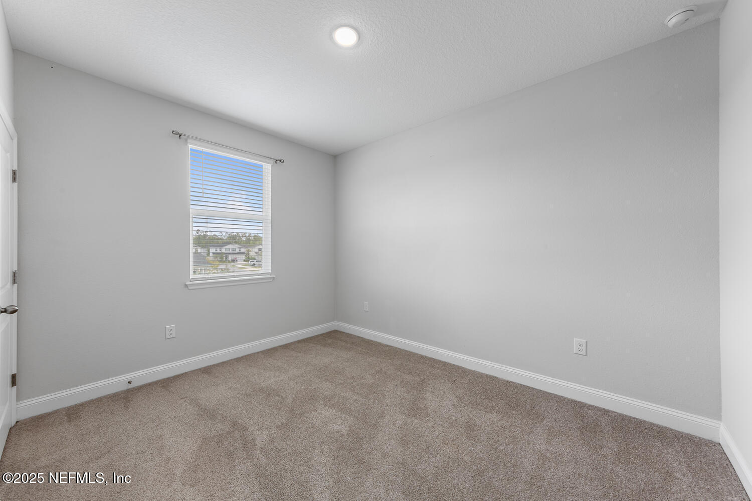 117 Redbud Lane Yulee, FL 32097 - Photo 17 of 20 an empty room with a window