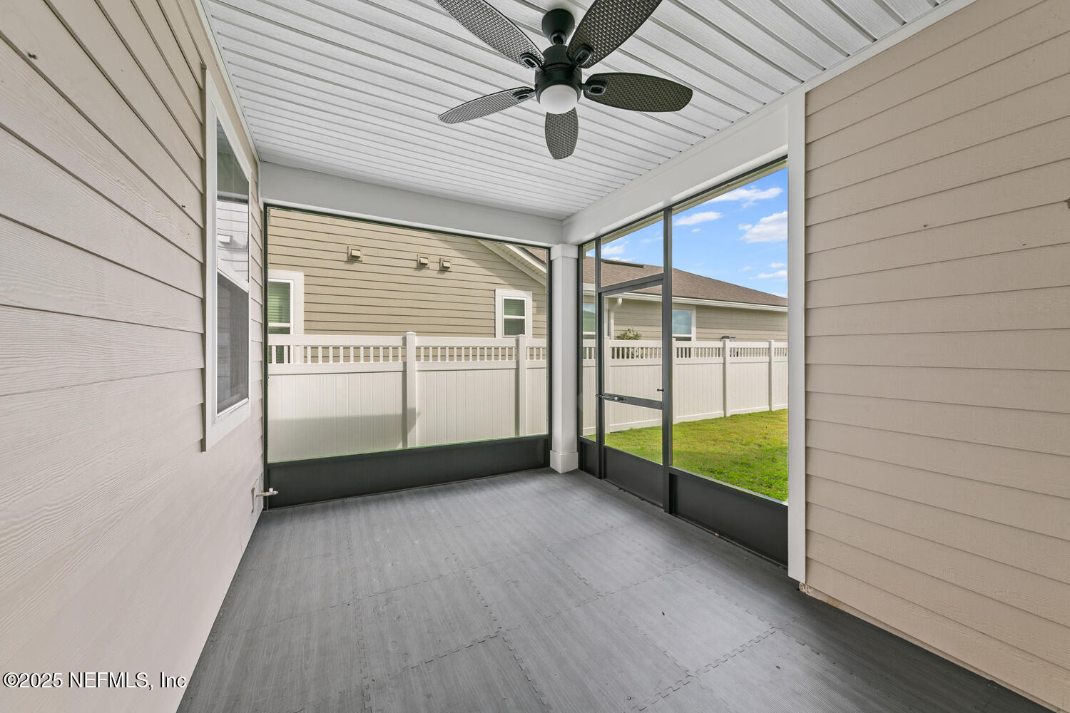 117 Redbud Lane Yulee, FL 32097 - Photo 20 of 20 a view of a livingroom with a ceiling fan and window
