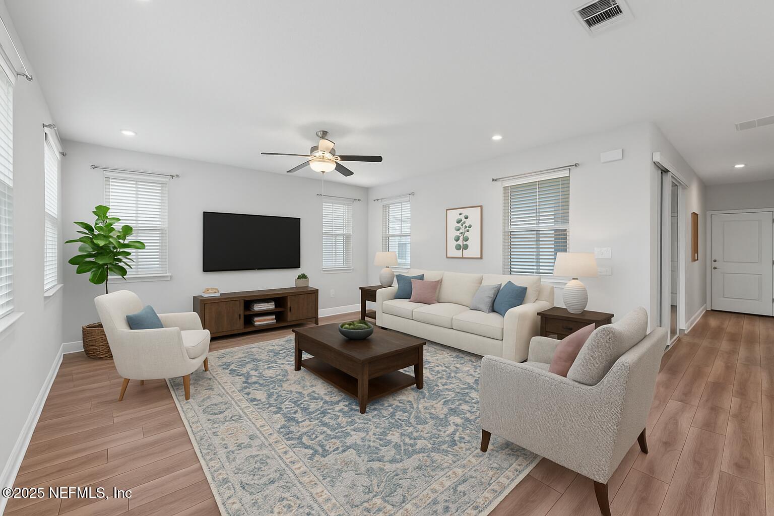 117 Redbud Lane Yulee, FL 32097 - Photo 3 of 20 a living room with furniture and a flat screen tv