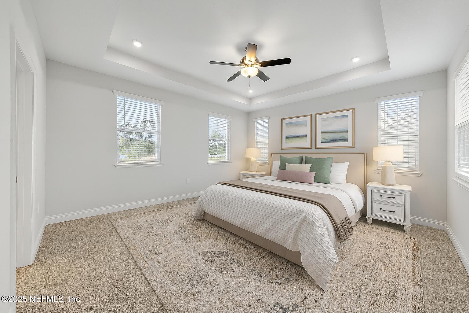 117 Redbud Lane Yulee, FL 32097 - Photo 9 of 20 a bedroom with a large bed and a window