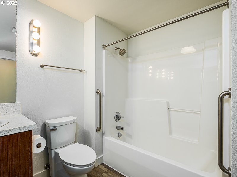 3970 North Interstate Avenue, Unit 208 Portland, OR 97227 - Photo 13 of 20 a white toilet sitting next to a bath tub shower