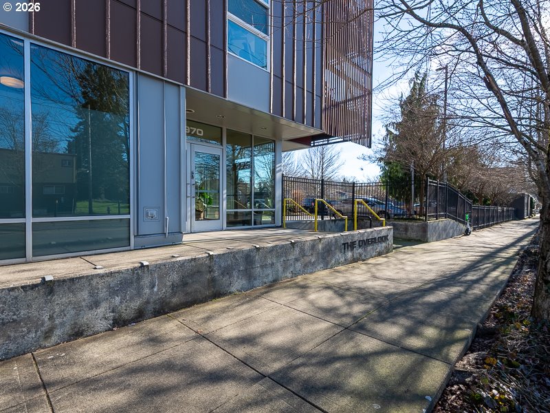 3970 North Interstate Avenue, Unit 208 Portland, OR 97227 - Photo 19 of 20 a view of a building with a bench in patio