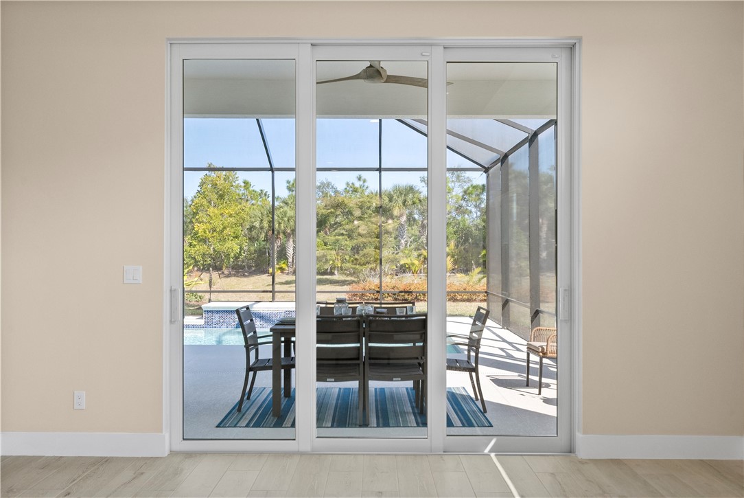 2148 Falls Manor Vero Beach, FL 32967 - Photo 22 of 25 a dining room with furniture and window