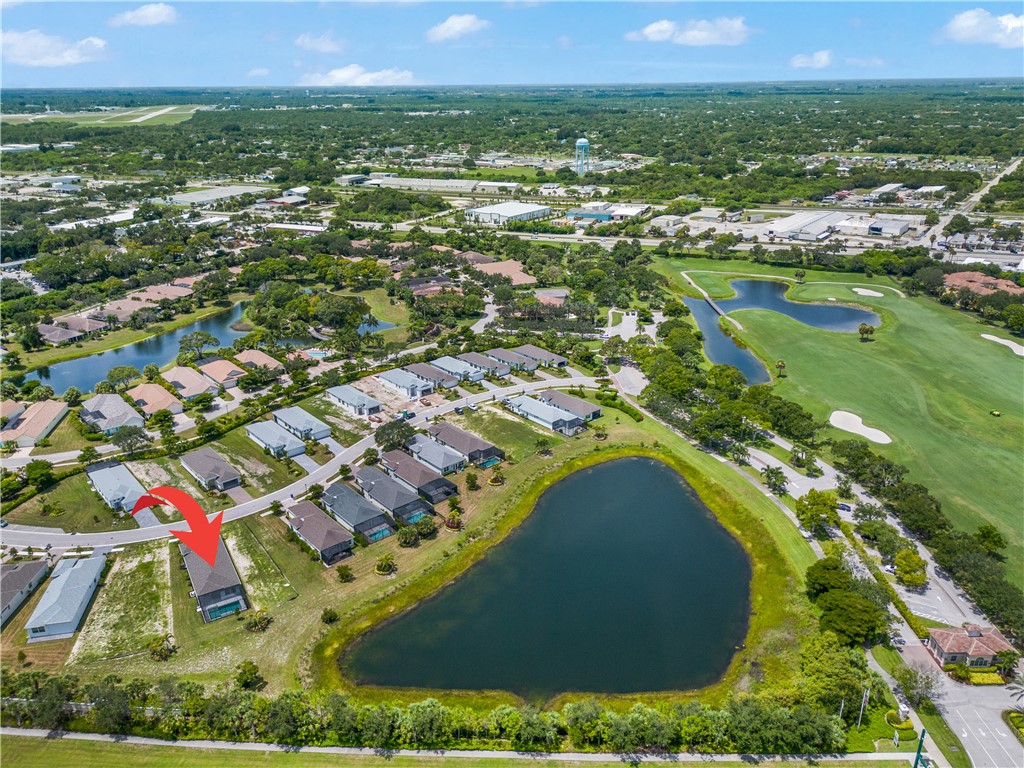 2148 Falls Manor Vero Beach, FL 32967 - Photo 24 of 25 an aerial view of residential houses with outdoor space and swimming pool