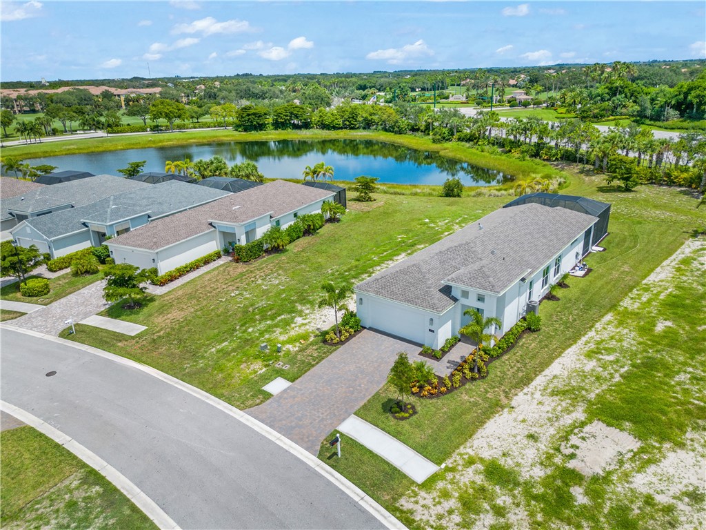2148 Falls Manor Vero Beach, FL 32967 - Photo 25 of 25 an aerial view of a house with a yard and lake view