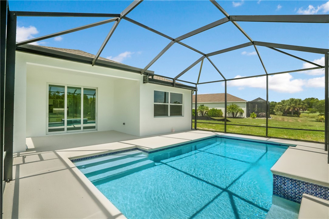 2148 Falls Manor Vero Beach, FL 32967 - Photo 5 of 25 a view of a house with a swimming pool