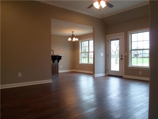 532 Halltown Road Portland, TN 37148 - Photo 6 of 15 an empty room with wooden floor and windows