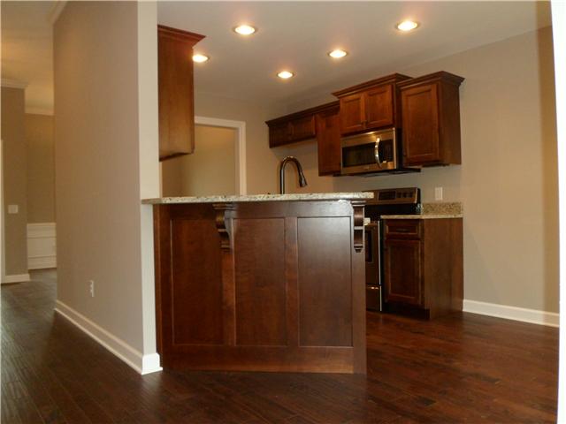 532 Halltown Road Portland, TN 37148 - Photo 7 of 15 a kitchen with stainless steel appliances granite countertop a refrigerator and a stove top oven