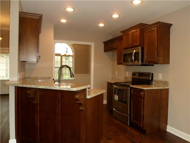 532 Halltown Road Portland, TN 37148 - Photo 8 of 15 a kitchen with stainless steel appliances wooden cabinets and a sink