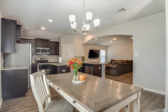 a kitchen with stainless steel appliances a microwave a stove and refrigerator