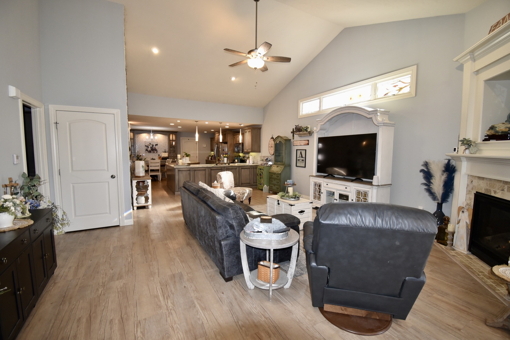 1915 Dunraven Road Bloomington, IL 61704 - Photo 11 of 26 a living room with furniture and a flat screen tv