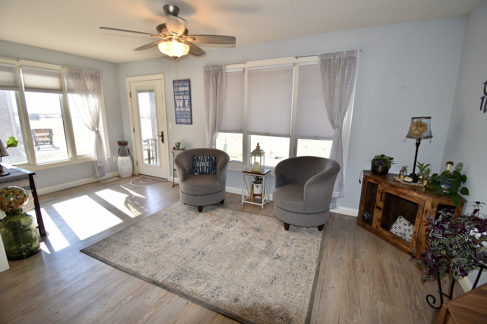 1915 Dunraven Road Bloomington, IL 61704 - Photo 12 of 26 a living room with furniture a window and a chandelier