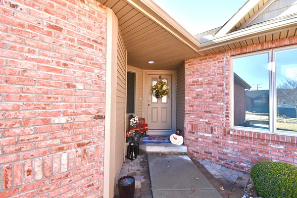 a front view of a house with a backyard