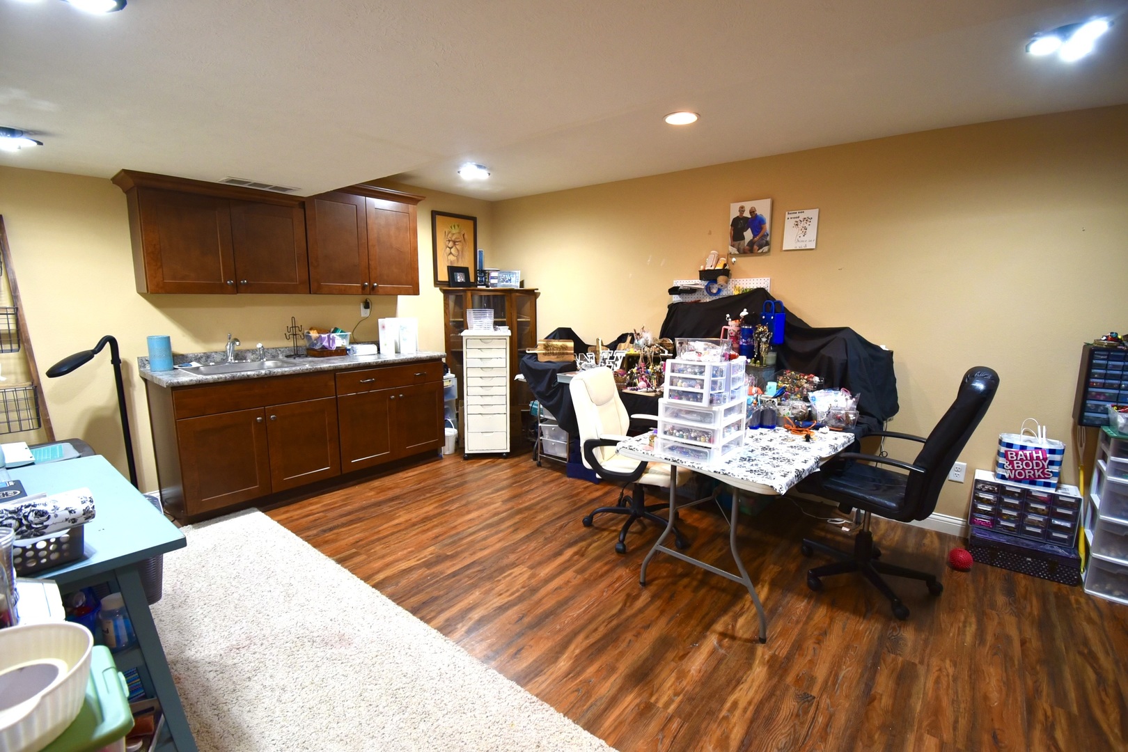 1915 Dunraven Road Bloomington, IL 61704 - Photo 21 of 26 a view of a dining room with furniture and wooden floor