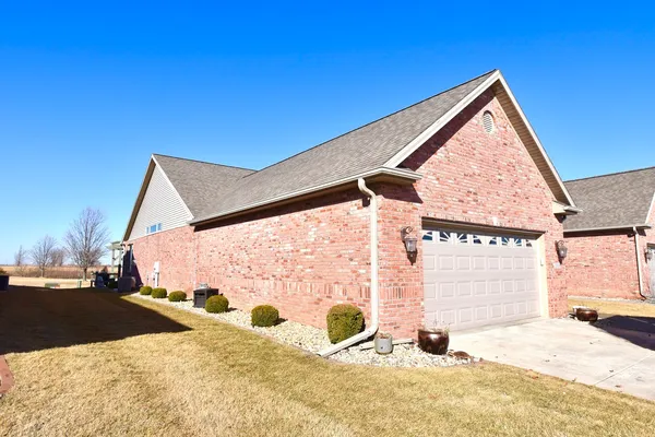 a kitchen with granite countertop a stove microwave and refrigerator