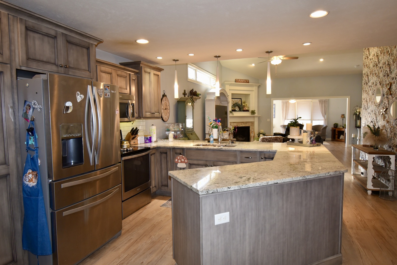 1915 Dunraven Road Bloomington, IL 61704 - Photo 7 of 26 a kitchen with stainless steel appliances granite countertop a refrigerator a sink and a stove