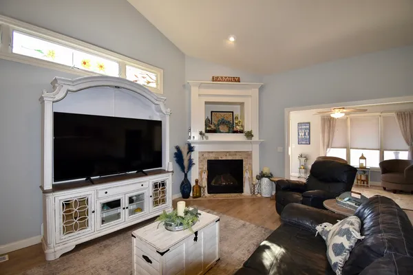 a living room with furniture and a flat screen tv