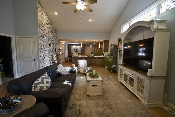 a living room with furniture and a flat screen tv