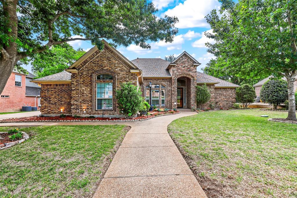 a front view of a house with yard