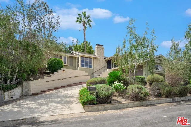 a house view with a garden space