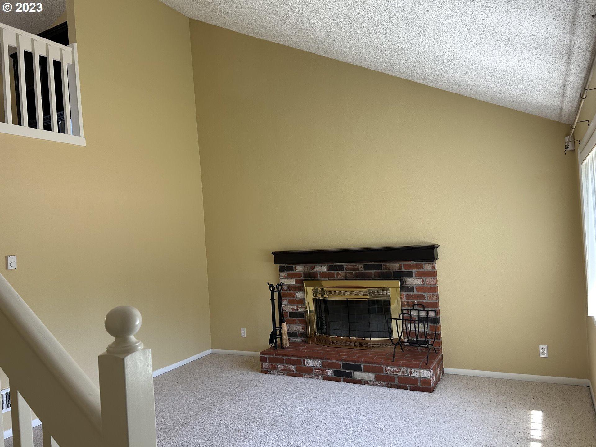 6558 Thurston Road Springfield, OR 97478 - Photo 2 of 26 a living room with a fireplace
