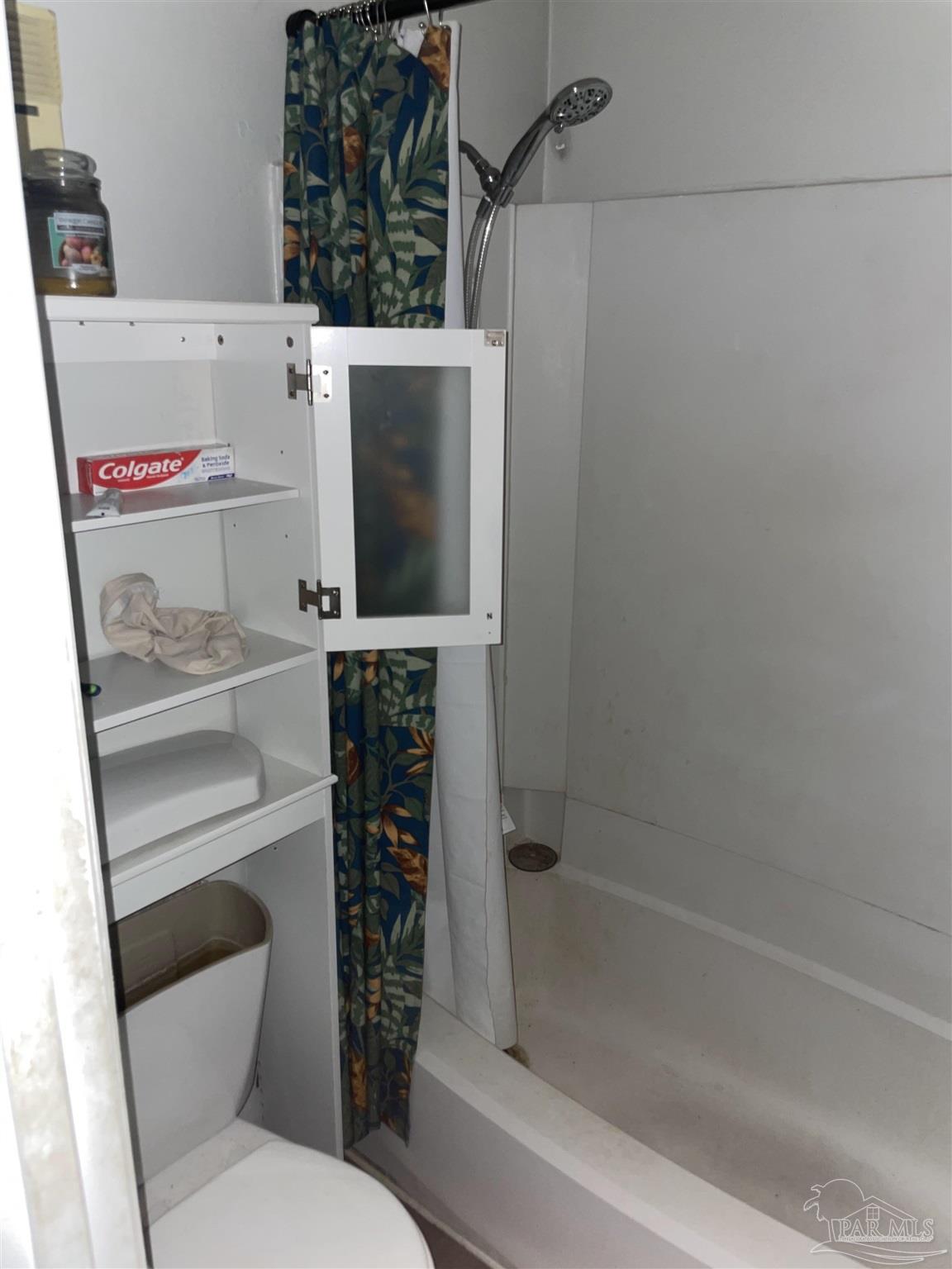 7150 Plantation Road, Unit 327 Pensacola, FL 32504 - Photo 17 of 24 a bathroom with a toilet and a bathtub