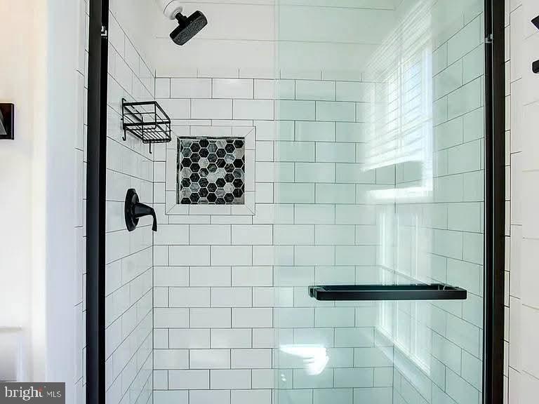 12148 Atlantic Road Temperanceville, VA 23442 - Photo 12 of 30 a bathroom with a shower