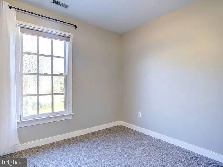 12148 Atlantic Road Temperanceville, VA 23442 - Photo 18 of 30 an empty room with a window
