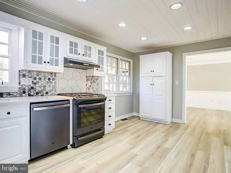 12148 Atlantic Road Temperanceville, VA 23442 - Photo 2 of 30 a kitchen with stainless steel appliances granite countertop a stove and a sink
