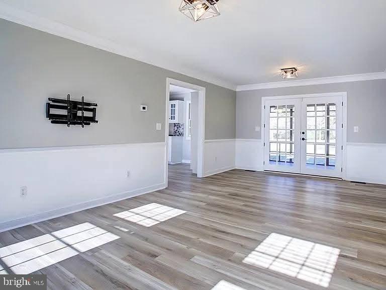 12148 Atlantic Road Temperanceville, VA 23442 - Photo 6 of 30 wooden floor in an empty room with a window
