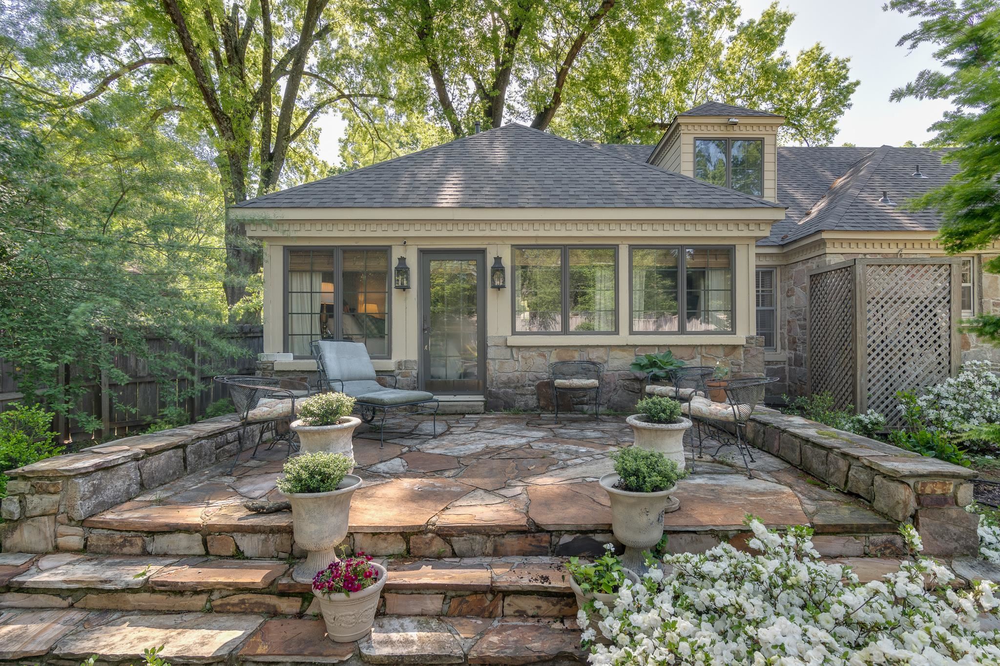 263 North Rose Road Memphis, TN 38117 - Photo 22 of 25 a front view of a house with garden and sitting area