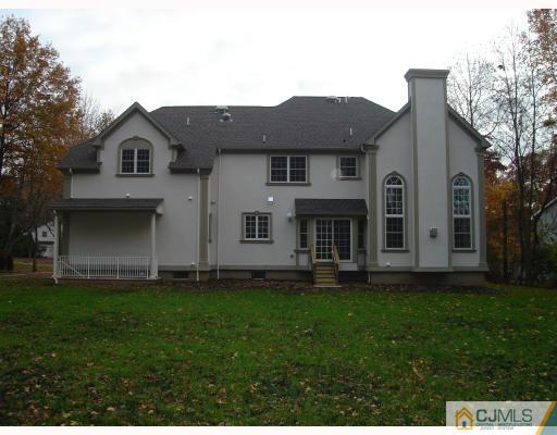 3 Fishel Road Edison, NJ 08820 - Photo 4 of 10 a front view of a house with a garden