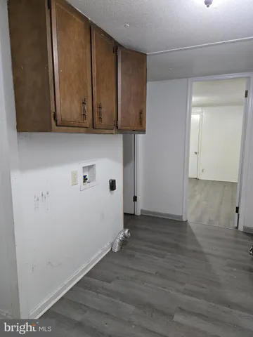 a view of a storage & utility room with wooden floor