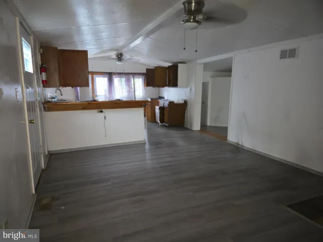 a kitchen with a refrigerator and a sink