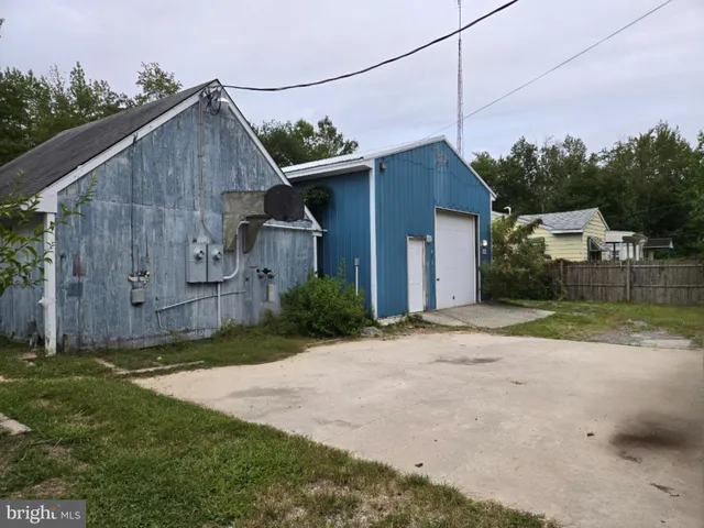 a backyard of a house with wooden fence