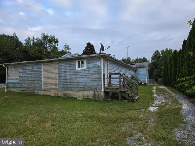 a view of a backyard with a cabin