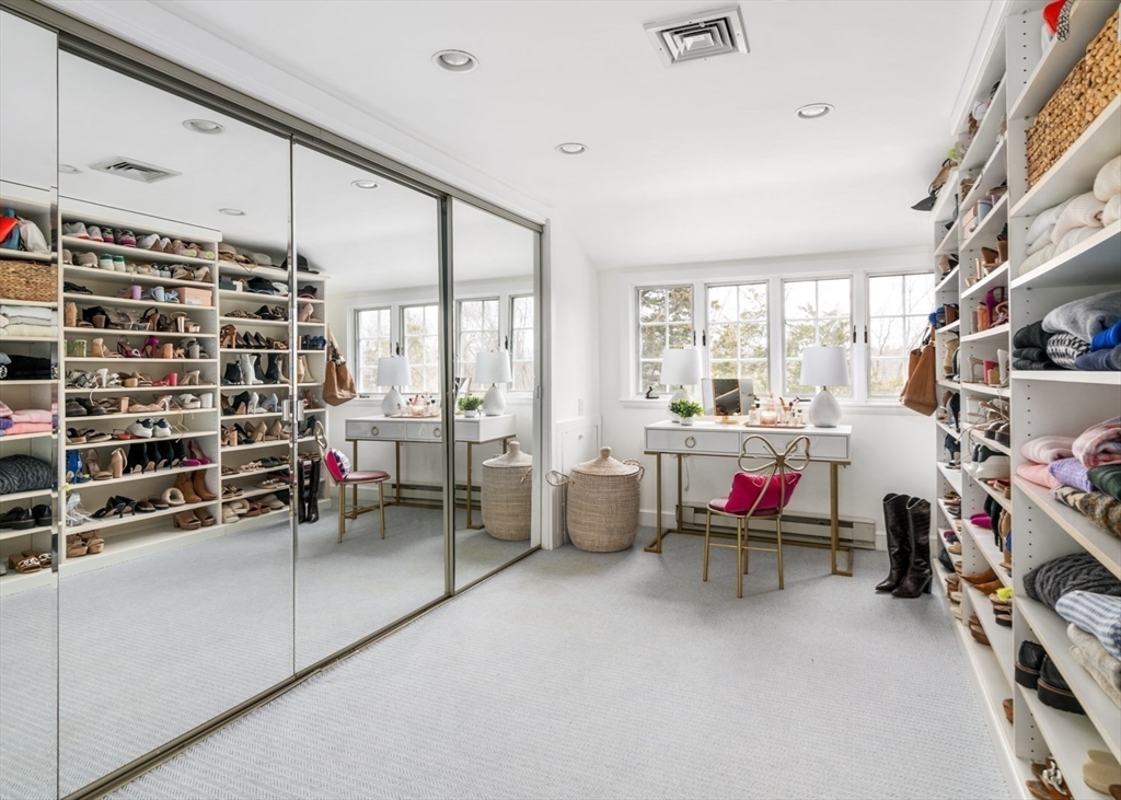 8 Rockwood Road Hingham, MA 02043 - Photo 16 of 27 a living room with furniture a flat screen tv and a book shelf