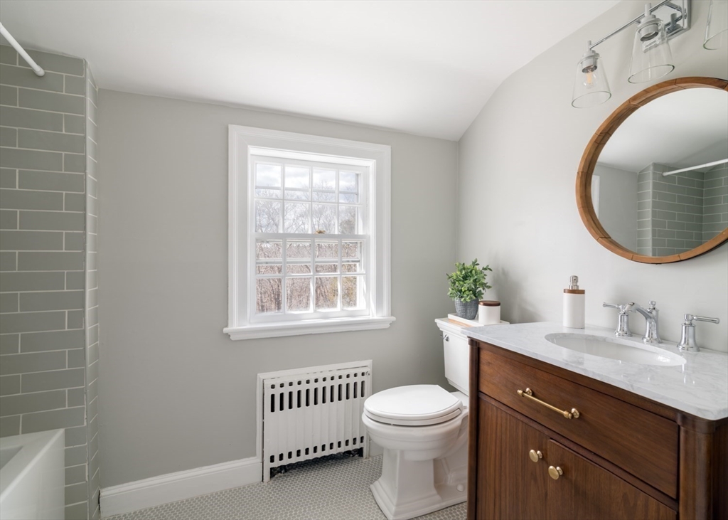 8 Rockwood Road Hingham, MA 02043 - Photo 18 of 27 a bathroom with a toilet a sink and mirror
